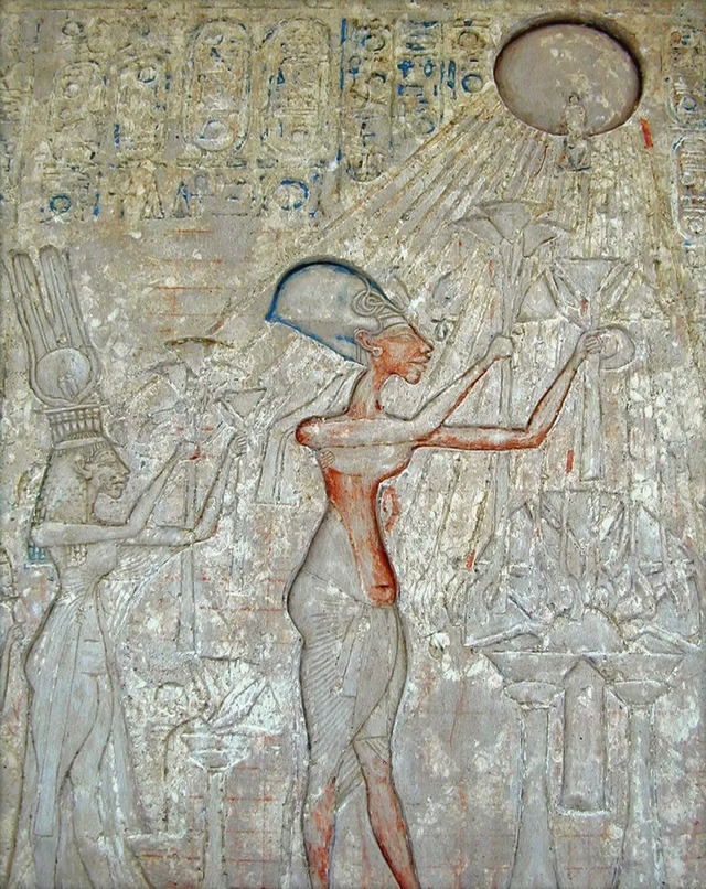 A limestone relief from Amarna vividly portrays Nefertiti, Akhenaten, and their daughters in reverent adoration of Aten, showcasing the spiritual devotion of the Amarna period.