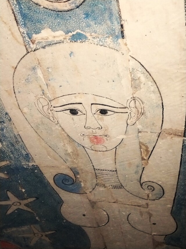 A painted depiction of Nut, the celestial goddess, adorning the ceiling of one of the burial chambers, representing the deceased's journey into eternity.