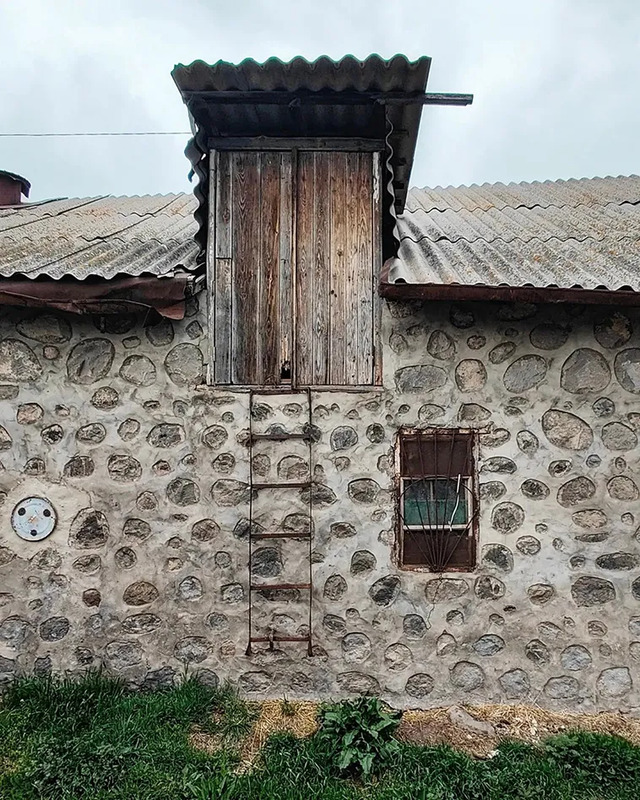 A quaint old stone house in Old Khndzoresk, its rustic charm a reminder of simpler times.