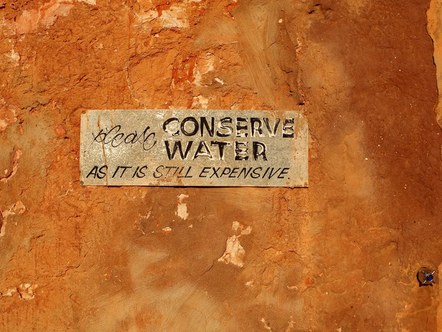 A sign in Coober Pedy reminds residents and visitors to conserve the precious resource of water.