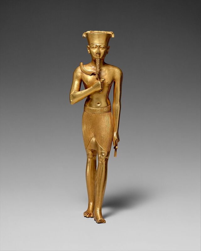 A statue of Amun, gilded in gold, highlights the enduring reverence for this supreme deity in Egyptian culture.