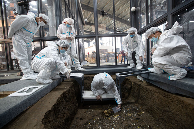 A team of researchers meticulously excavates artifacts at the Sanxingdui site, bringing to light the mysteries of an ancient civilization.