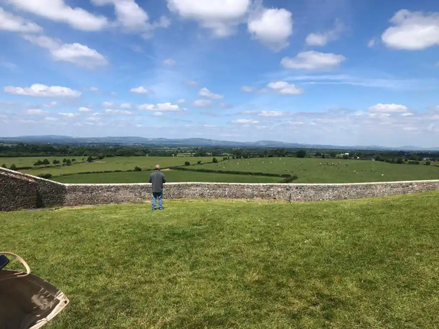 This aerial shot captures the grandeur of Ireland's historic fortress, perched atop a limestone hill, surrounded by the lush green fields of County Tipperary.