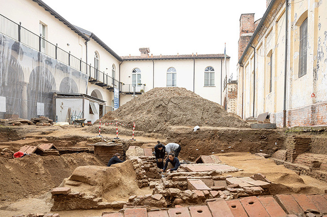 A view of the excavation site under the 15th-century cloister, revealing well-preserved stone and tile tombs of Lombard royalty.