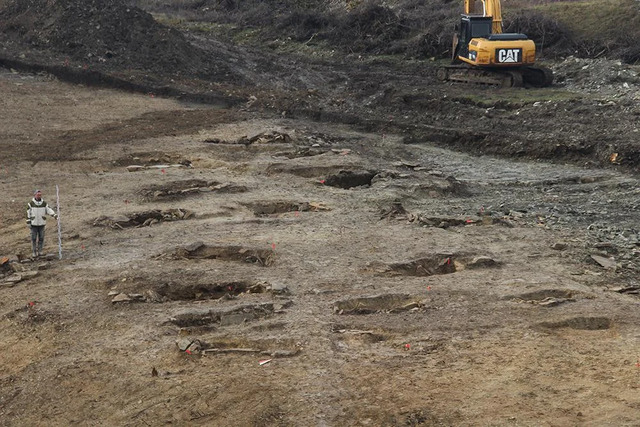 A wide-angle view of the burial site following the completion of excavations.