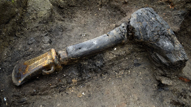 Among the Many Well-Preserved Artifacts Discovered at Must Farm, Near Peterborough, Was a Metal Axe Head With Its Wooden Shaft Intact.