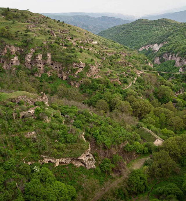 An aerial perspective of the sprawling caves of Khndzoresk, showcasing the intricate relationship between human ingenuity and the rugged landscape.