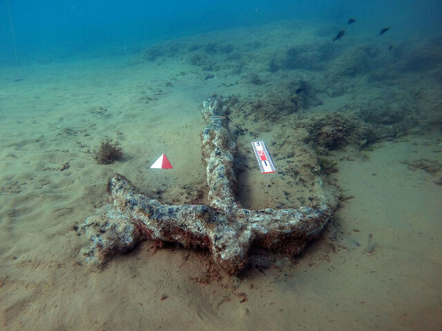 An ancient iron anchor, dating back to the 7th century CE, discovered near the shipwreck site, reflecting centuries of maritime history.