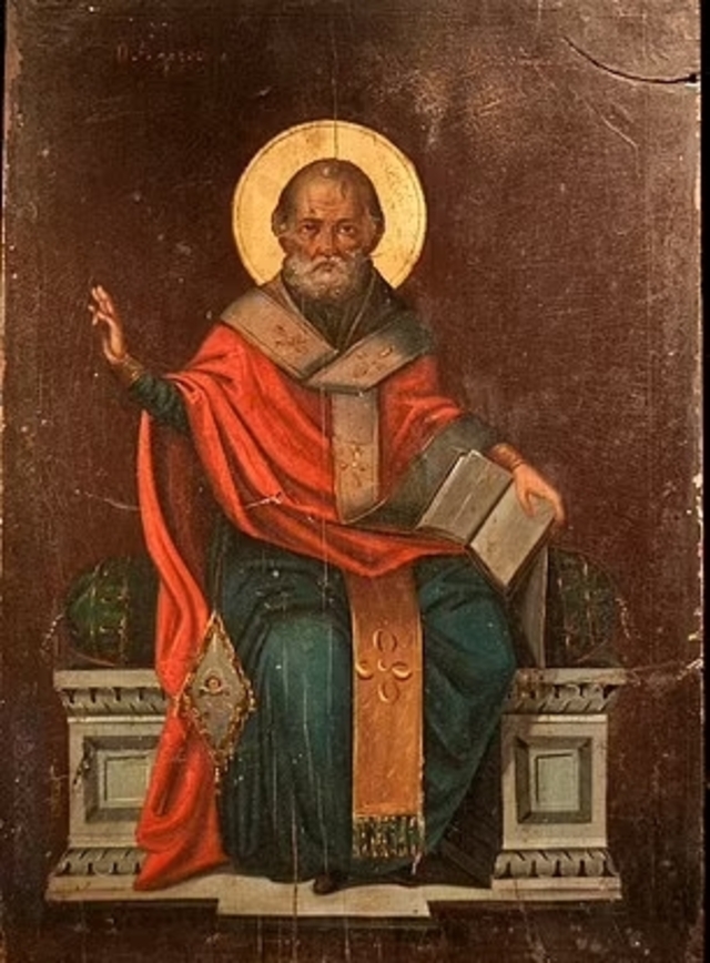 An iconic painting of Saint Nicholas, often depicted with a halo and clerical garments, symbolizing his sainthood.