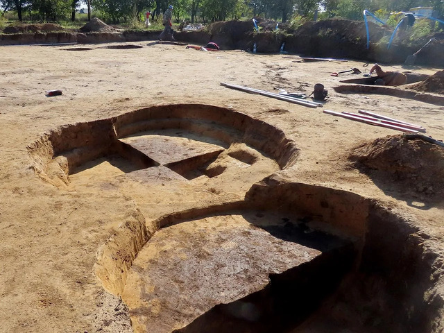 Archaeologists working on the site, uncovering layers of history within the Sandomierz Upland.