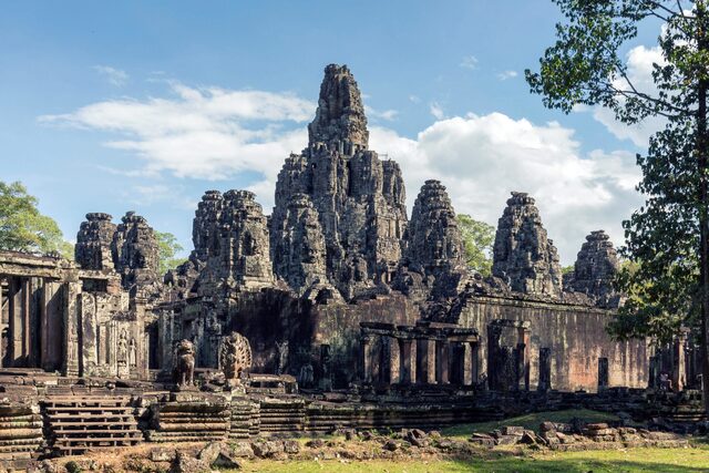 At its center stood the Bayon Temple, crowned with numerous towers adorned with serene faces—a motif echoed in the gates of the city.