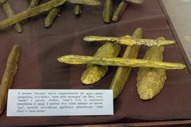 Bars of orichalcum recovered from the shipwreck are displayed in Gela, Sicily. This rare metal alloy is linked to legends of Atlantis. 