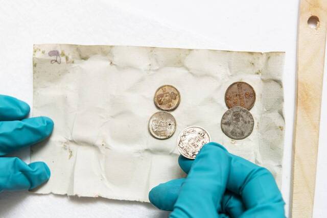 Coins preserved in a 140-year-old time capsule were part of the extraordinary discoveries made during the excavation.