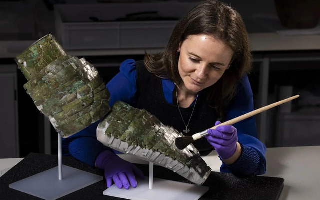 Conservator Bethan Bryan meticulously restores the ancient Roman arm-guard, bringing history back to life.