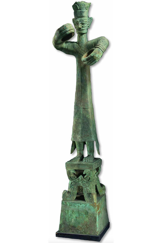 Discovered in 1986, an imposing eight-foot-tall bronze figure, believed to depict a priest in ritual, was found in a pit brimming with artifacts at Sanxingdui.