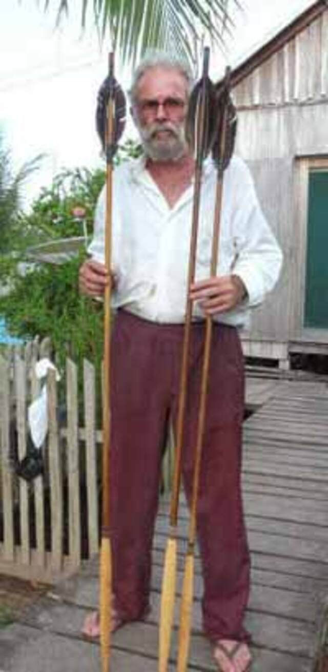 Former FUNAI official José Carlos Meirelles holds arrows crafted by uncontacted Indigenous tribes, offering a glimpse into their unique craftsmanship.