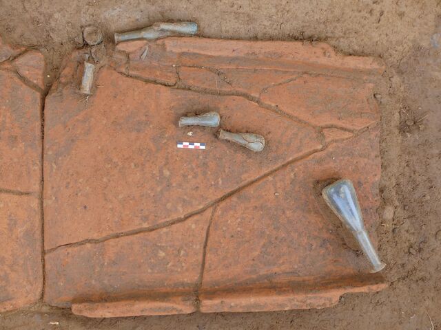 Glass balsamaria found within the tile graves provide a fascinating connection to ancient funerary customs.