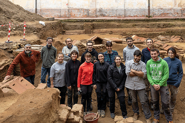 The excavation team from Università Cattolica del Sacro Cuore celebrates their discovery of over 20 medieval burials at the cloister site in Pavia.