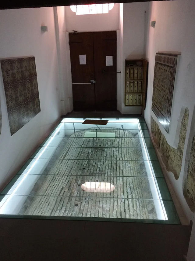 In Italy, an apartment building lobby reveals its ancient secrets through a glass floor.