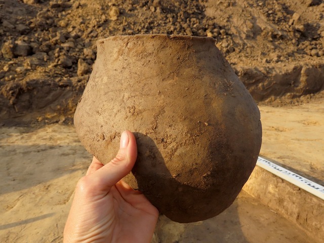 Intact Neolithic ceramic vessel recovered from the settlement, providing insight into daily life.