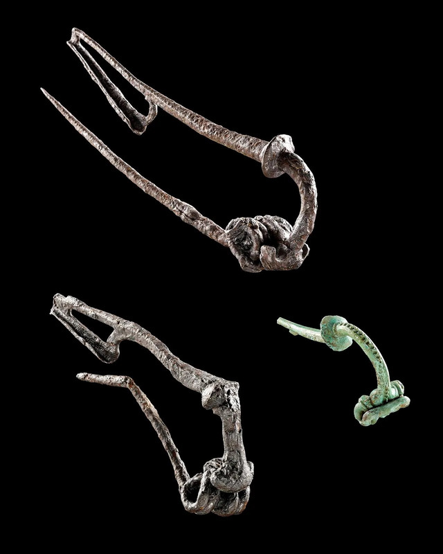 Intricately crafted Late Celtic brooches, dating back to the 1st century BC, fashioned from bronze and iron.