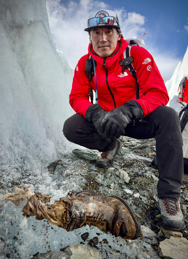 Jimmy Chin, leader of the National Geographic team, poses with Irvine’s boot after its remarkable discovery on the Central Rongbuk Glacier.