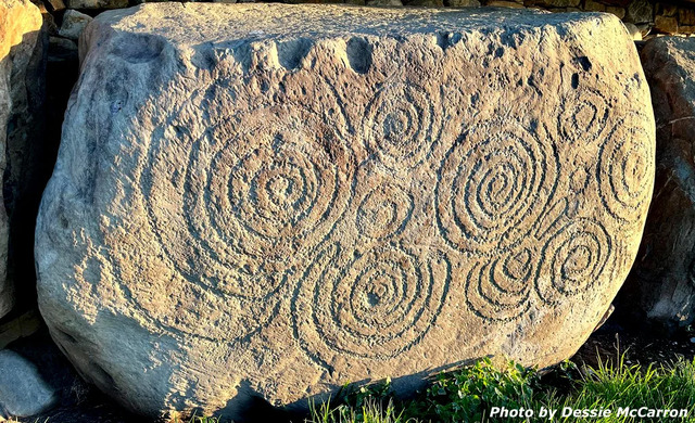 Kerbstone 56: Multiple anti-clockwise spirals and radial lines