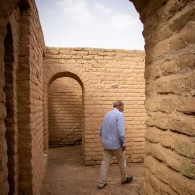 Local guide Geena Truman explores the ancient corridors of the Ziggurat of Ur, enriching the visitor experience with detailed narratives.