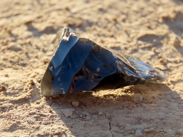 Obsidian tool fragment, highlighting the advanced tool-making techniques of the period.