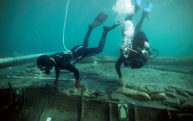 Researchers analyze the inner framework of the ship to better understand Phoenician shipbuilding techniques.