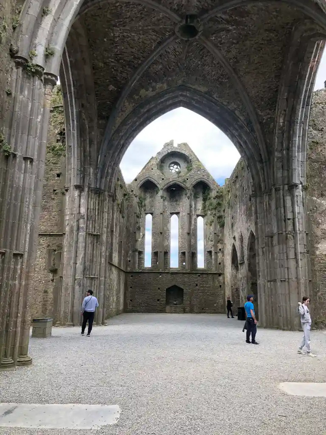 Rows of decorative arcading on the exterior wall highlight the Norman influence in the architectural style of The Rock of Cashel.