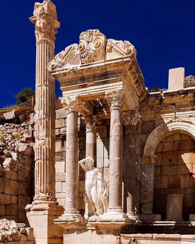 The Heroon of Sagalassos, adorned with intricate carvings and statues, symbolizing the city's cultural and artistic heritage.