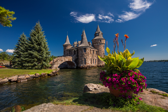 The Power House, an enchanting structure located on Heart Island, highlighting its unique design and picturesque setting by the water.