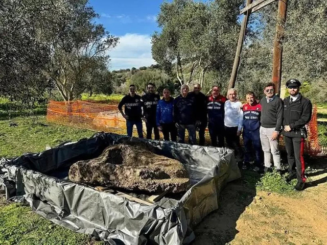 The Team of Archaeologists Proudly Poses With the Recovered Fragment, Highlighting a Triumph in Underwater Excavation