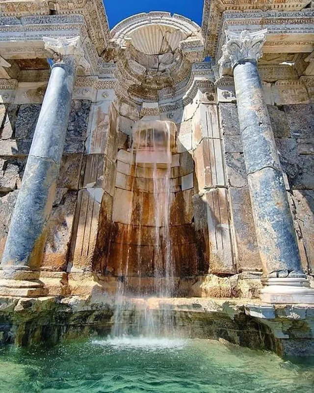 The cascading fountain of the Nymphaeum, a stunning example of Roman hydraulic engineering and design.