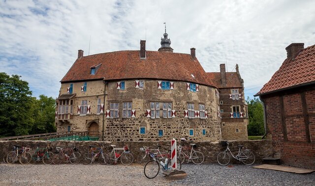 The castle courtyard, surrounded by bicycles, illustrating its modern-day accessibility for visitors.