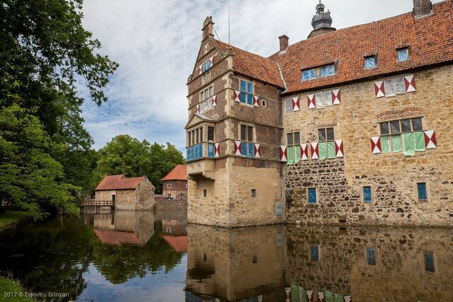 The castle’s side profile mirrored perfectly in the surrounding waters, symbolizing its harmony with nature.