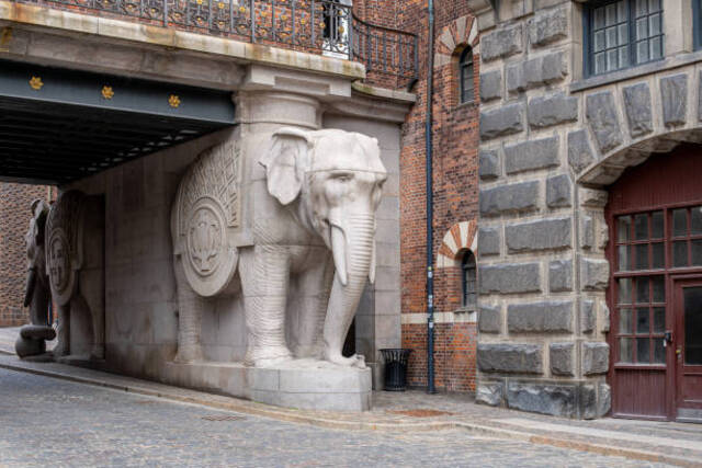 The elephants’ bodies are sculpted with exceptional attention to detail, from the curves of their trunks to the patterns on their ornate saddles.