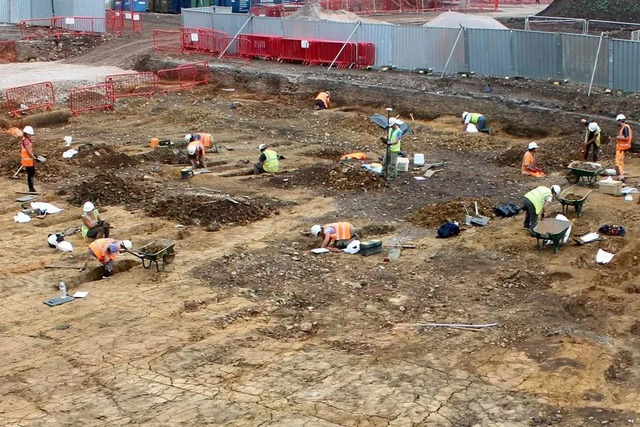 The excavation team works tirelessly at the former workhouse site, unearthing artifacts that shed light on its past.