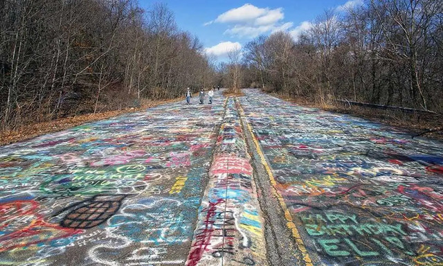 The famously graffitied stretch of road in Centralia, now known as “Graffiti Highway,” left abandoned as the town became uninhabitable.