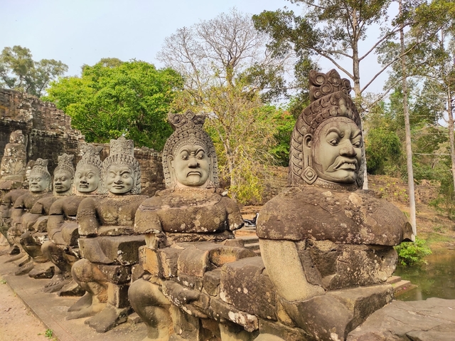 The figures of devas and asuras, locked in their eternal struggle, reflect the Khmer worldview of harmony achieved through the interplay of opposites