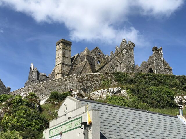 The grandeur of The Rock of Cashel captured from the ground, showcasing its timeless charm and imposing structure.