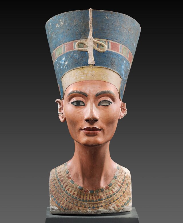 The heart of the Nefertiti Bust is carved from limestone, skillfully layered with varying thicknesses of stucco to achieve its remarkable detail.