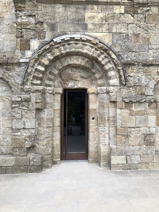 The intricately detailed doorway, a testament to the skilled craftsmanship of medieval times.