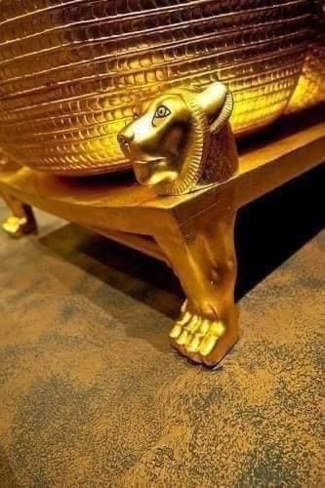 The lion-shaped foot of a golden ceremonial bed found in King Tutankhamun's tomb, representing strength and divine guardianship.