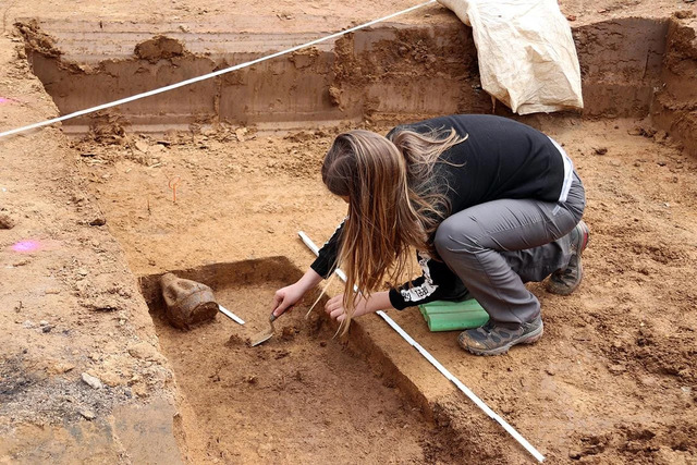 The meticulous process of uncovering the ancient grave, preserving every detail of its historical significance.