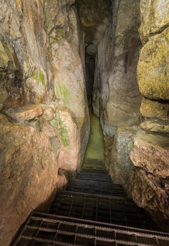 The narrow pathway inside Hezekiah's Tunnel, revealing the remarkable hand-chiseled walls carved through solid rock.