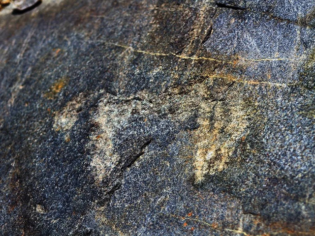 The petroglyphs, located near the Gavia Pass, are etched into rocks shaped by thousands of years of glacial activity.