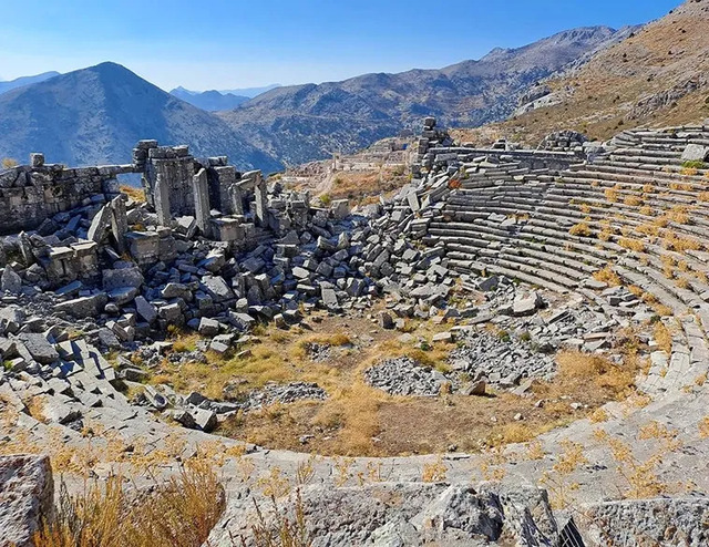 The remains of the grand theatre at Sagalassos, offering a panoramic view of the surrounding mountains.