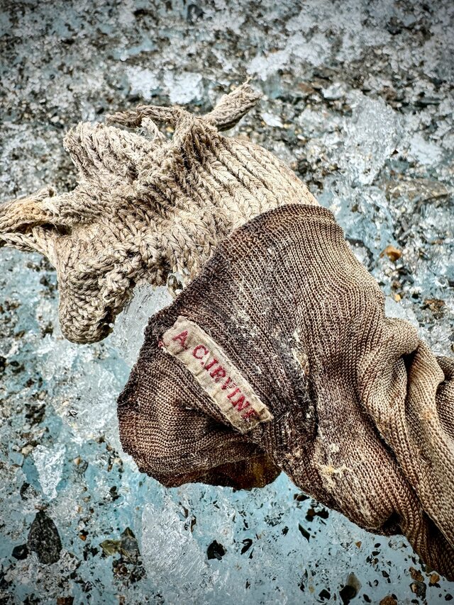 The sock embroidered with “A.C. Irvine,” a poignant reminder of the young climber’s connection to the fateful Everest expedition.